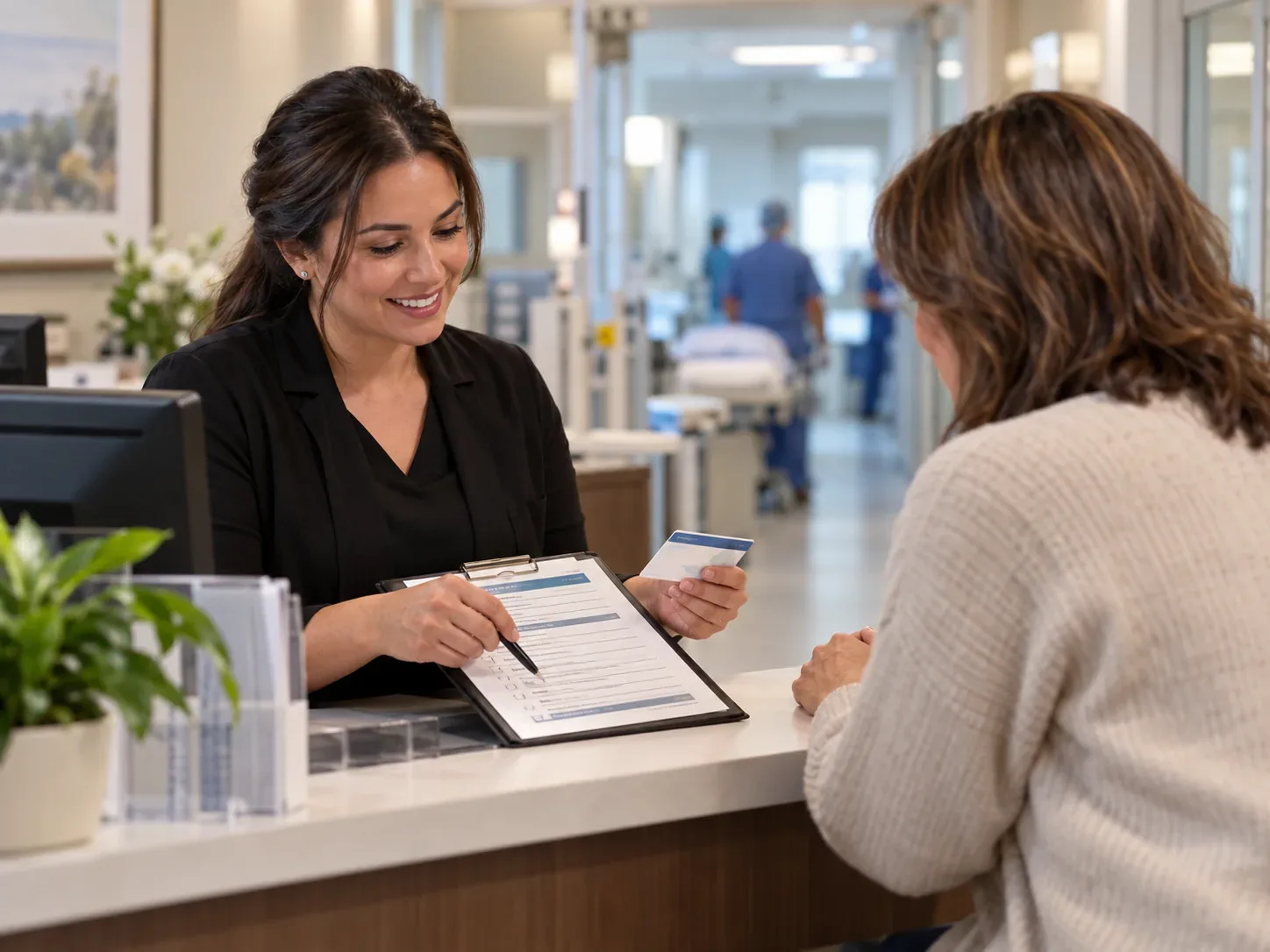 ASC financial clearance specialist discusses insurance and authorization with a patient